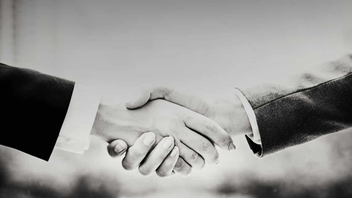 Black and white image of two hands shaking | eminent domain lawyer | RSNVLAW